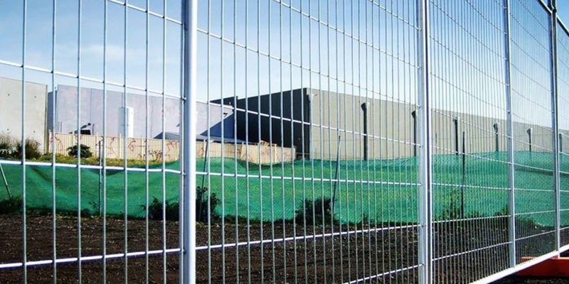 Fence and security barrier installed around an industrial site